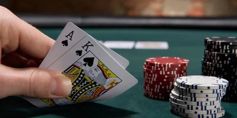 A UK blackjack table showing the player area, dealer position, cards, and betting space.